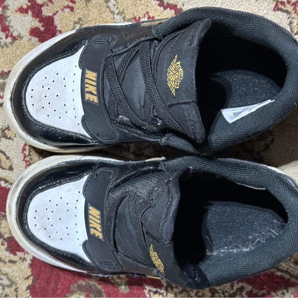 Nike Kids Black and White Sneakers with Gold Accents